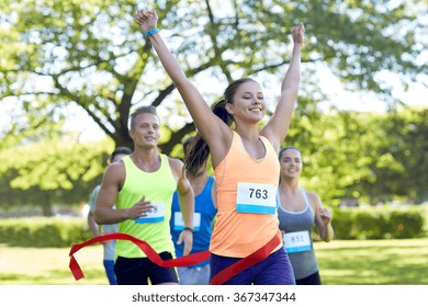 Happy Young Female Runner Winning On Race Finish