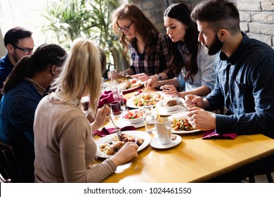 Happy Young Friends Hangout In Coffee Shop