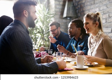 Happy young friends hangout in coffee shop - Powered by Shutterstock