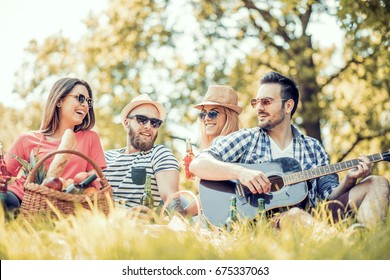 Happy Young Friends Having Fun Outside In Nature.