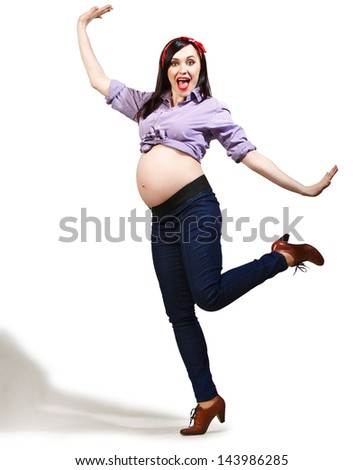 Happy young funny pregnant woman in pin up style