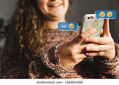 Happy Young Girl Texting On Her Phone