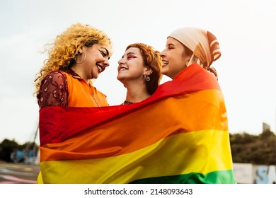 Happy young girls celebrating gay pride festival - LGBT community concept  - Powered by Shutterstock