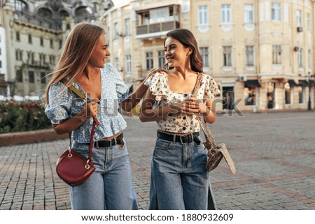 Image, Stock Photo two blonde sister with e-cigar smoking in bar terrace