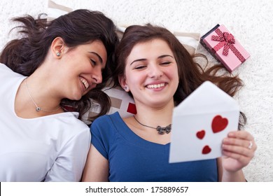 Happy Young Girls Having Fun Reading Love Letter