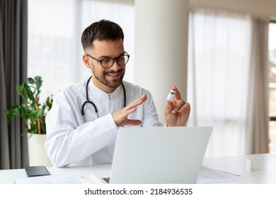 Happy Young GP Doctor Holding Distant Web Camera Meeting, Giving Professional Consultation To Patient Using Computer Video Call App, Virtual Healthcare Event Concept.