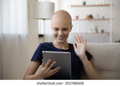 Happy Young Hairless Woman Waving Hand, Starting Video Call Conversation On Digital Tablet With Doctor, Hearing Good News, Feeling Excited Of Effective Cancer Treatment Test Results, Modern Tech Usage