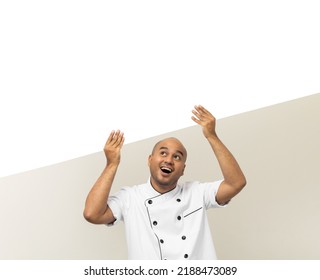 Happy Young Handsome Asian Man Chef In Uniform Holding An Empty Whiteboard. Cooking Indian Man With Big Blank Billboard For Advertising Text Menu In Kitchen And Restaurant.