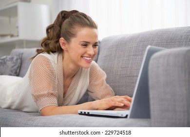 Happy Young Housewife Making Online Shopping