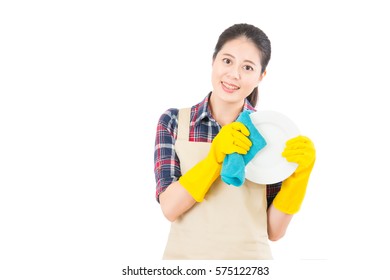 happy young housewife washing wipe dishes with rag on isolated white background. Beautiful fresh energetic multiracial Chinese Asian female model.
