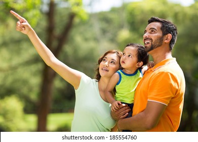 Happy Young Indian Family Bird Watching Outdoors