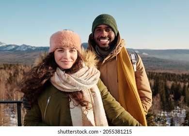 Happy Young Intercultural Couple Enjoying Winter Day In Natural Environment