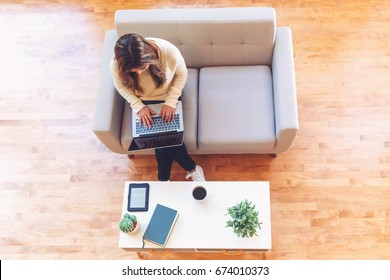 Happy Young Latina Woman Working On Her Laptop At Home