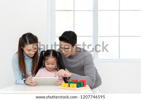 Similar – Image, Stock Photo Family Engaged with Technology in London