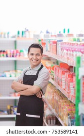 happy young male staff working at super market - Shutterstock ID 753589141