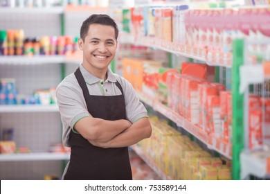 Happy Young Male Staff Working At Super Market