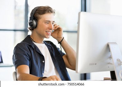 Happy young man designer working - Shutterstock ID 750514066