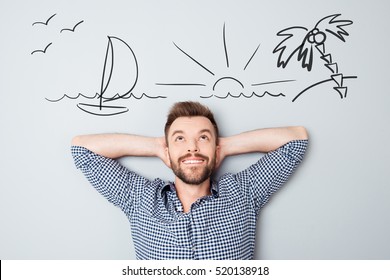 Happy young man dreaming about vacation. Drawn picture of seaside overhead. - Shutterstock ID 520138918