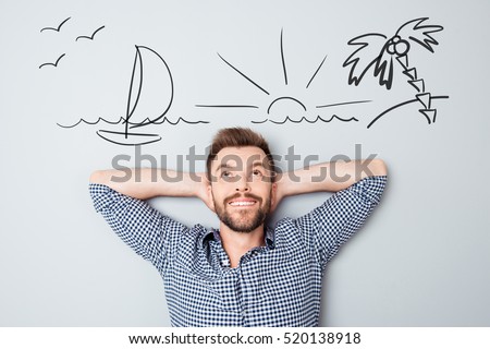 Happy young man dreaming about vacation. Drawn picture of seaside overhead.