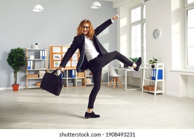 Happy Young Man Having Fun As It's Time To Finish Work. Funny Joyful White-collar Worker Holding Briefcase And Leaving Office. Overjoyed Long-haired Male Employee Going Home At The End Of Work Day