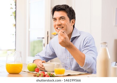 Happy Young Man Having Healthy Breakfast