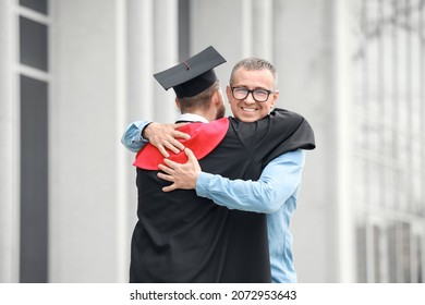 Happy Young Man With His Father On Graduation Day