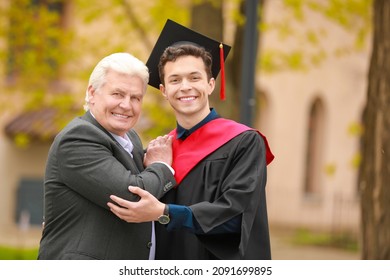 Happy young man with his father on graduation day - Powered by Shutterstock