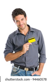 Happy Young Man Holding Credit Card On Heart Isolated On White Background