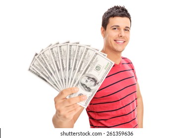 Happy Young Man Holding A Pile Of Cash Isolated On White Background
