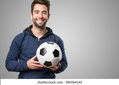 Happy Young Man Holding A Soccer Ball