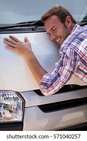 Happy Young Man Hugging His Car