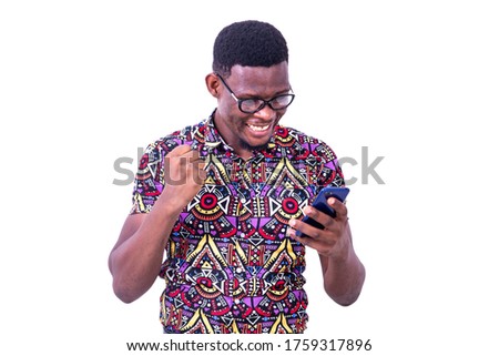 Similar – African man blue background with mobile phone.