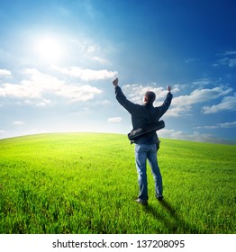 Happy Young Man Looking At The Sun