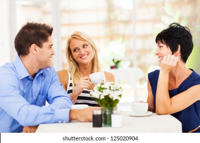 Happy Young Man Meeting Mother In Law With His Wife