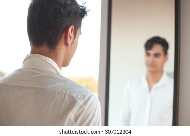 Happy Young Man With Mirror