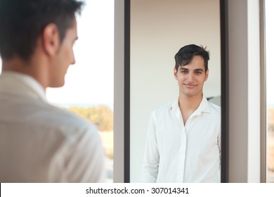 happy young man with mirror