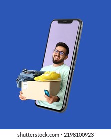 Happy young man with parcel looking out of smartphone screen on blue background. Online shopping concept - Shutterstock ID 2198100923