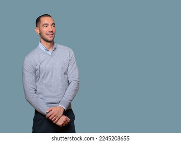 Happy young man posing against background - Shutterstock ID 2245208655