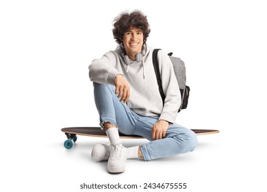 Happy young man sitting on a skateboard isolated on white background - Powered by Shutterstock