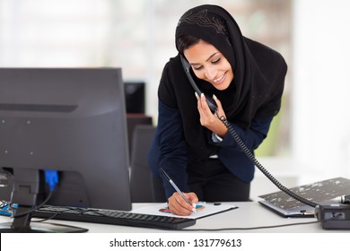 Happy Young Middle Eastern Businesswoman Working In Office