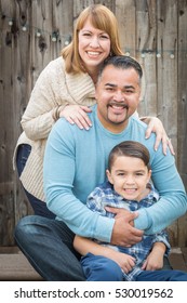 Happy Young Mixed Race Family Portrait Outside.