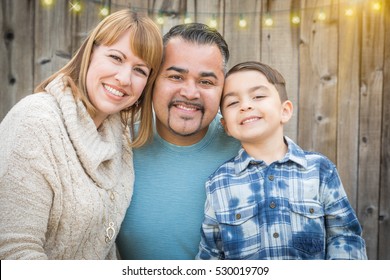 Happy Young Mixed Race Family Portrait Outside.