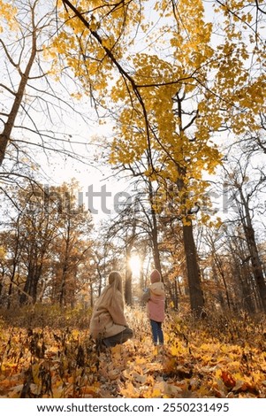 Similar – Women friends laughing while walking in forest