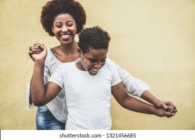 Happy Young Mother Having Fun With Her Child - Mom Playing And Dancing With His Son - Family Lifestyle, Motherhood, Love And Tender Moments Concept - Focus On Boy Face