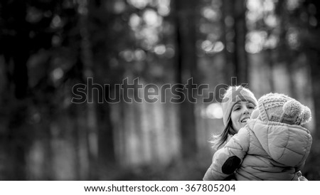 Similar – Baby schläft auf einer Decke mit der Hand ihrer Mutter.