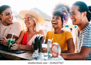 Happy Young People Drinking At Beach Cocktail Bar - Multiracial Friends Hanging Out Enjoying Summer Vacation - Summertime Holidays With Guys And Girls Laughing Outside