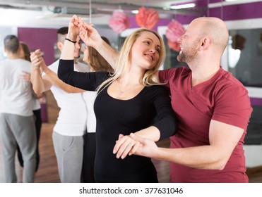 Happy Young People Having  Samba Dancing Class Indoors