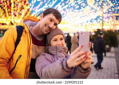 Happy Young People Take A Selfie Outdoors During The Christmas Days. Valentines Day