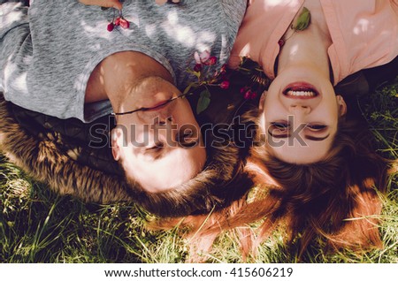 Similar – Women friends with sunglasses looking each other lying