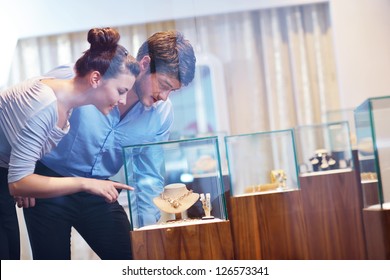 Happy Young Romantic Couple In Love Buy Jewelry Ring In Luxury Store